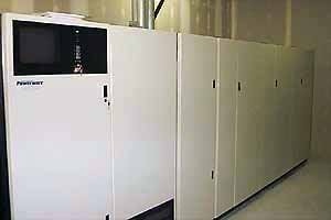 Row of large white PowerWare UPS cabinets in the DBN/Intira data center